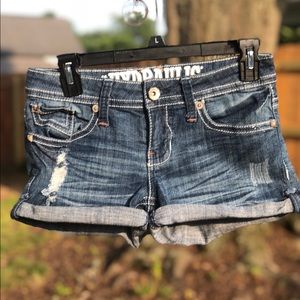 Distressed blue jean shorts